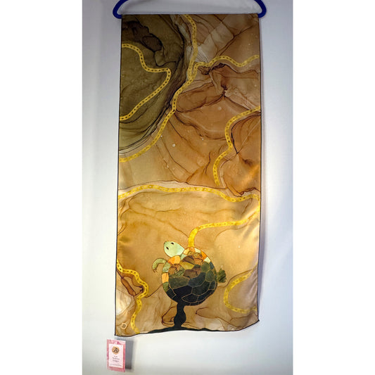 Decorative beige and green scarf with turtle design on a white background. Unique silk scarf suitable for client appreciation gifts and luxury corporate gifts.