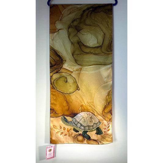 Decorative brown-green silk scarf with a turtle design on a white background. Unique silk scarf suitable for client appreciation gifts and luxury corporate gifts.
