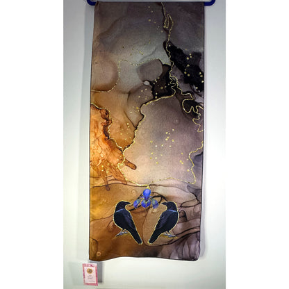 Artistic depiction of crow birds and a blue iris flower on a textured surface of a silk scarf, with a white background. Unique silk scarf suitable for client appreciation gifts and luxury corporate gifts. 