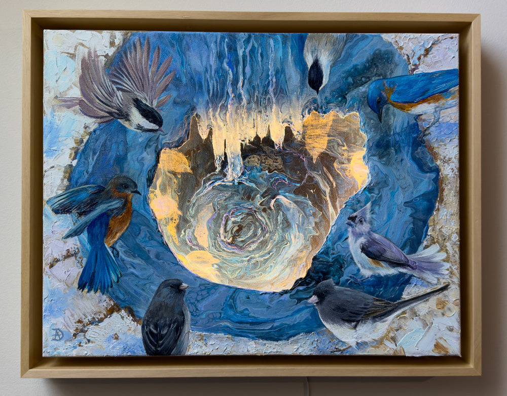 Framed artwork with backyard birds, such as bluebirds, juncos, titmice and chickadees, gathered around a small pond. The painting has abstract elements and an overall blue tonality.