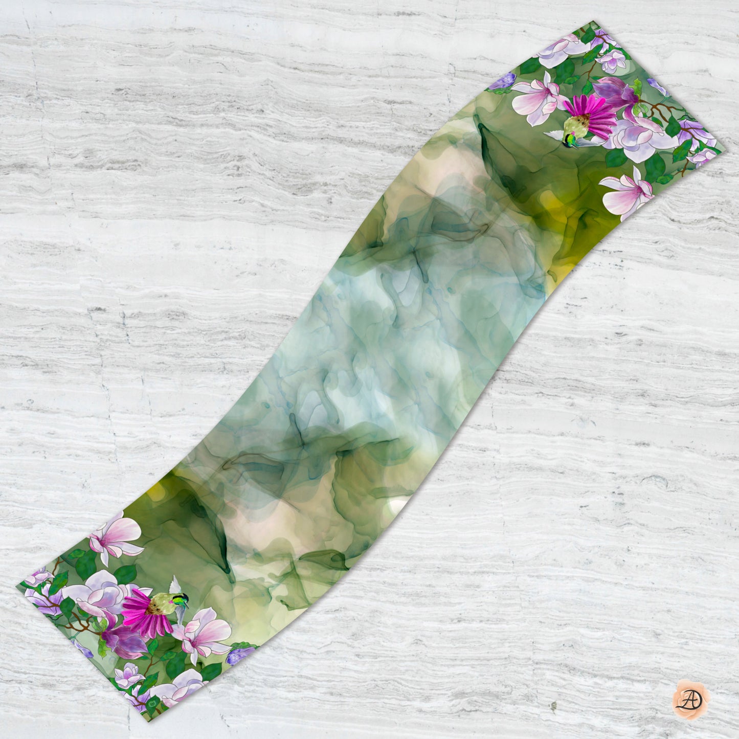Floral patterned silk charmeuse scarf with pink and purple flowers and a hummingbird on a green background. Unique silk scarf suitable for client appreciation gifts and luxury corporate gifts. 