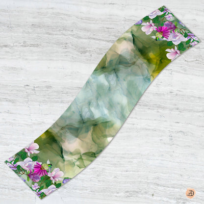 Floral patterned silk charmeuse scarf with pink and purple flowers and a hummingbird on a green background. Unique silk scarf suitable for client appreciation gifts and luxury corporate gifts. 