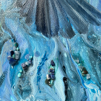 Close-up of a textured blue and gray surface with embedded stones