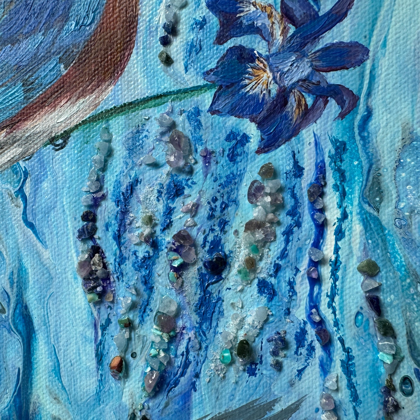 Close-up of a textured painting with blue tones