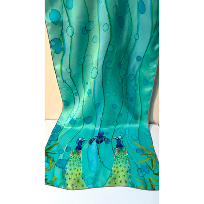 Teal silk scarf with peacock design on a white background. Unique silk scarf suitable for client appreciation gifts and luxury corporate gifts. 