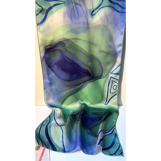 Colorful scarf with abstract peacock eye patterns on a white background. Unique silk scarf suitable for client appreciation gifts and luxury corporate gifts. 