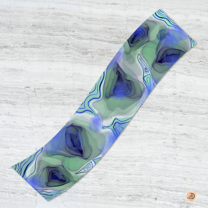 Colorful scarf with abstract peacock eye patterns on a white background. Unique silk scarf suitable for client appreciation gifts and luxury corporate gifts. 