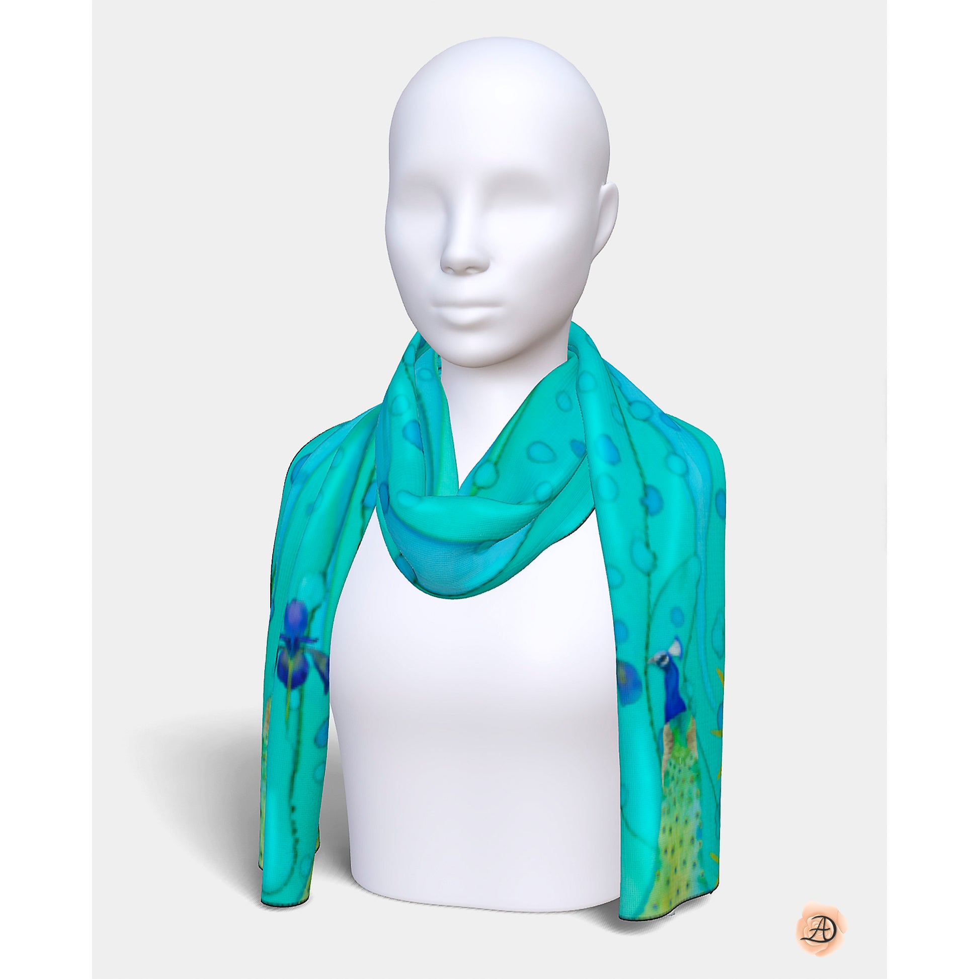 Mannequin wearing a teal scarf with peacock designs on a white background. Unique silk scarf suitable for client appreciation gifts and luxury corporate gifts. 