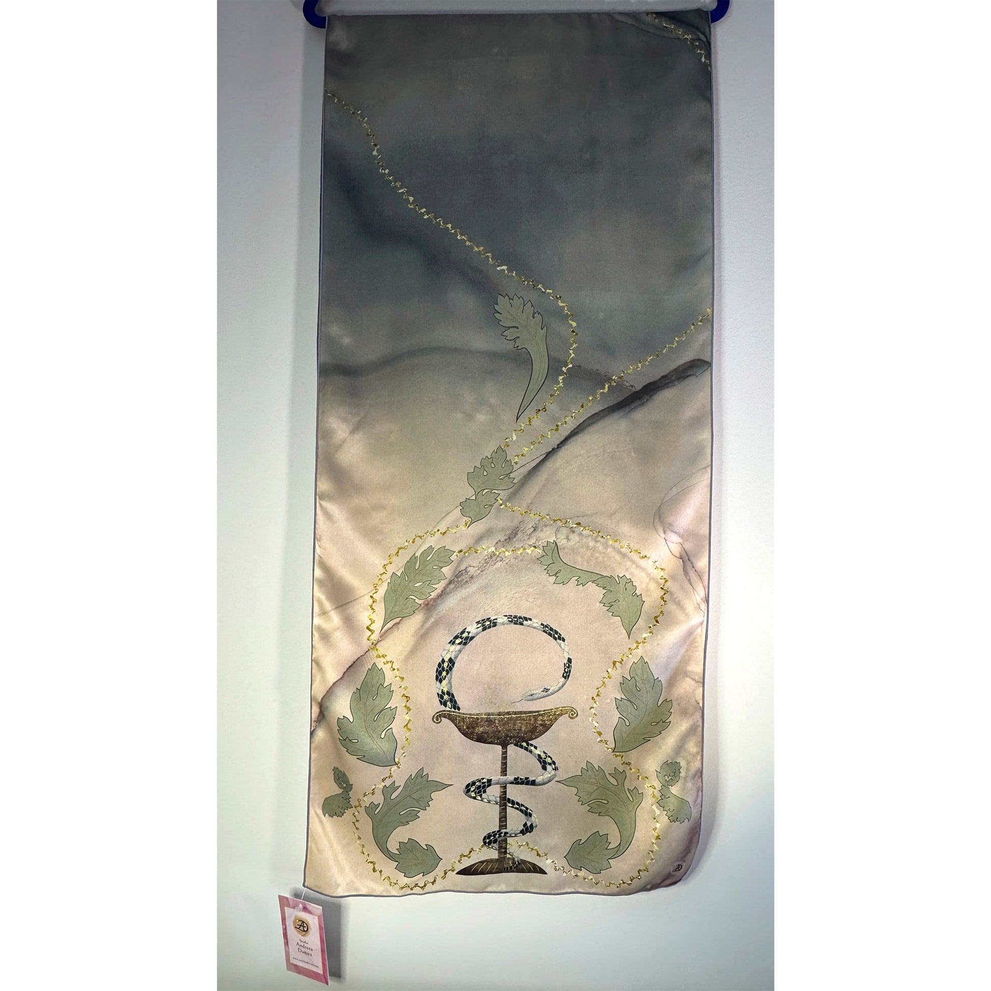 Silk Charmeuse scarf with a decorative print of the Bowl of Hygieia (medicine and pharmacy symbol with the snake wrapped around a chalice) and acanthus leaves on a beige-green abstract background. Unique silk scarf suitable for client appreciation gifts and luxury corporate gifts. Great gift for doctors, nurses, hospital residents. 