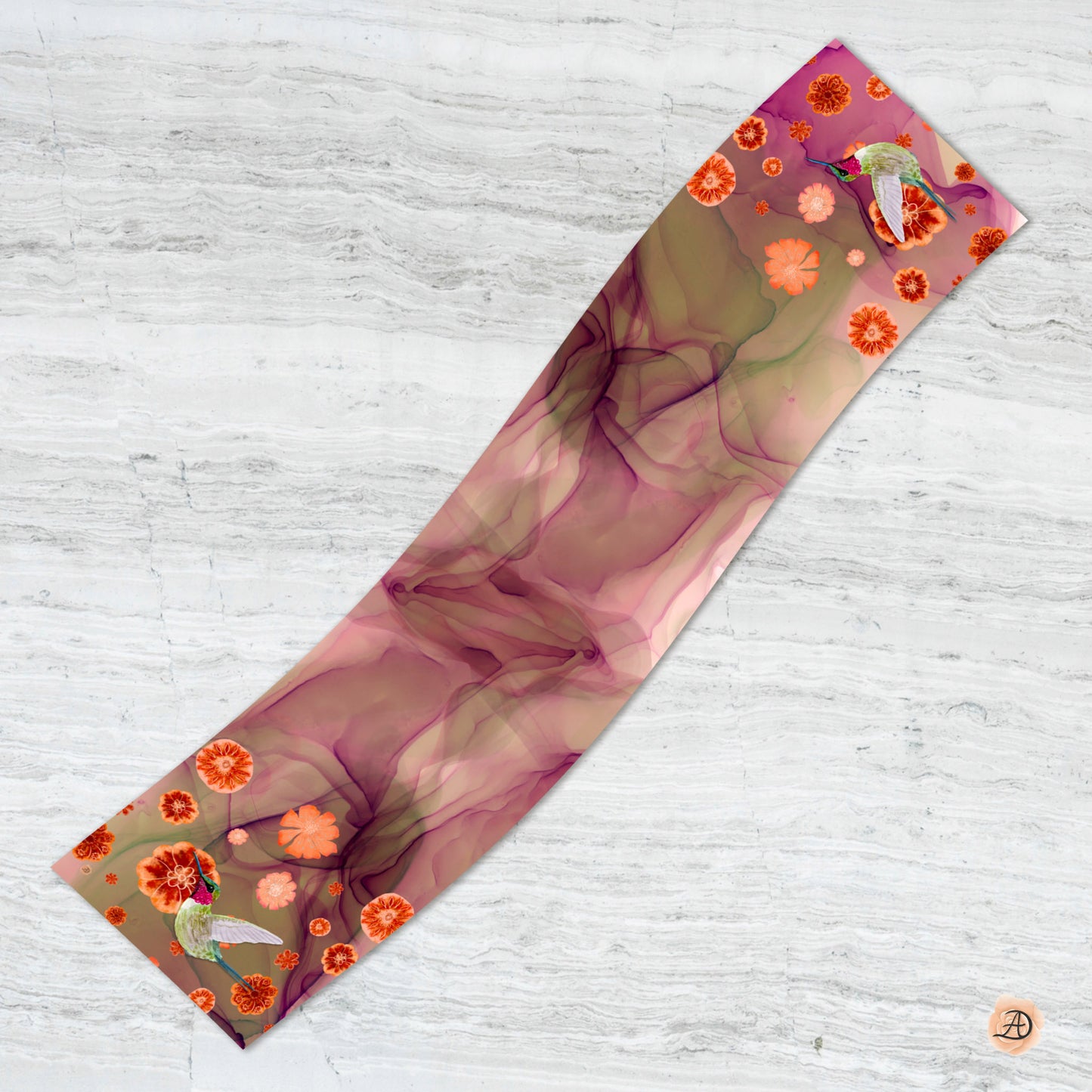 Decorative silk scarf with floral and hummingbird design against a white marble background. Unique silk scarf suitable for client appreciation gifts and luxury corporate gifts. 
