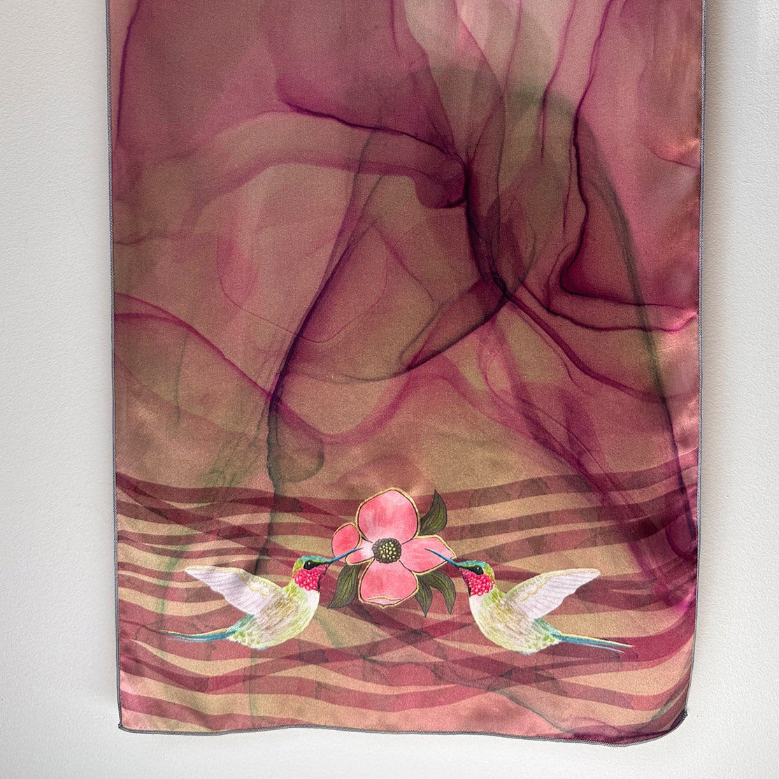 Silk scarf with hummingbirds and floral design on a white background