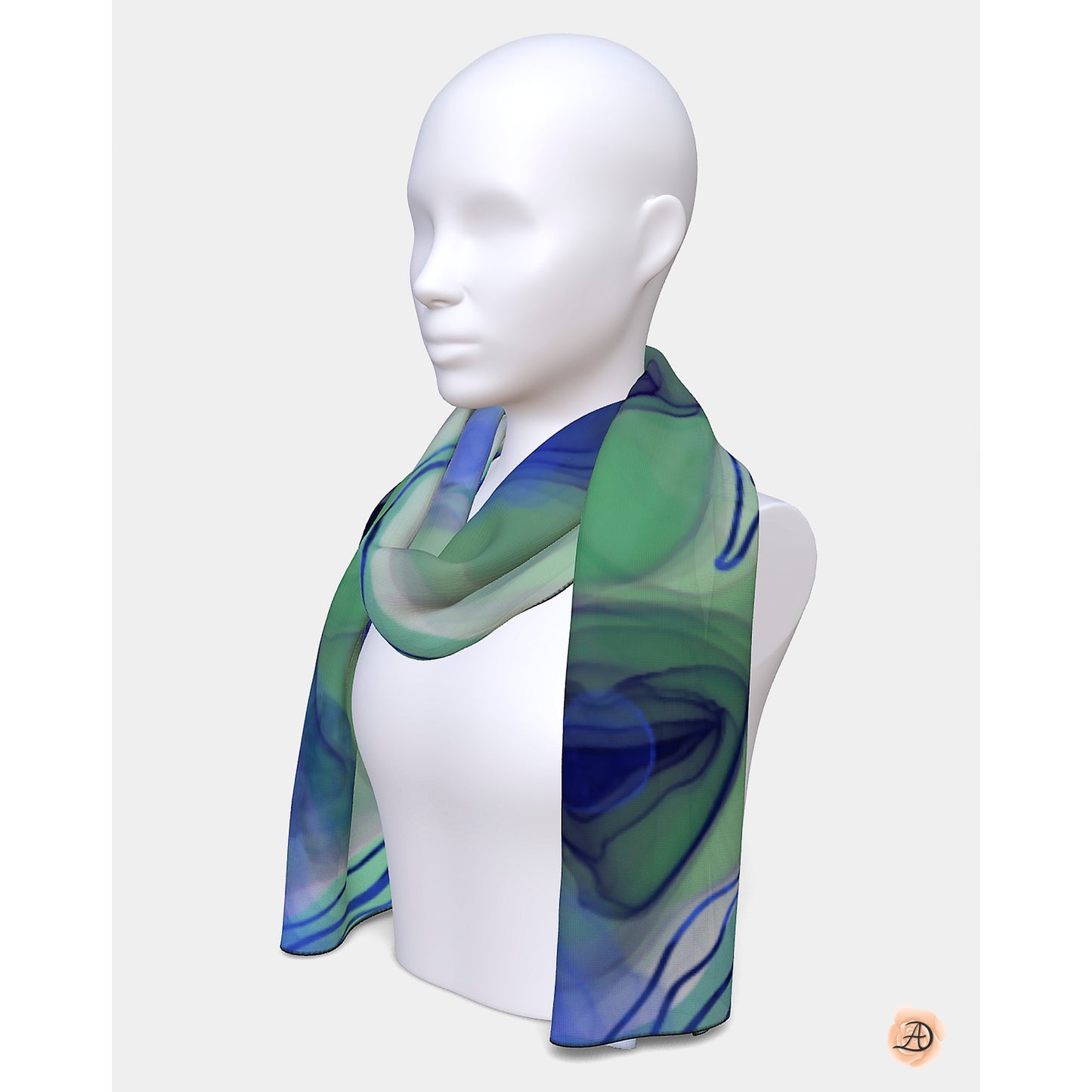 Mannequin wearing a green and blue patterned scarf on a white background. Unique silk scarf suitable for client appreciation gifts and luxury corporate gifts. 