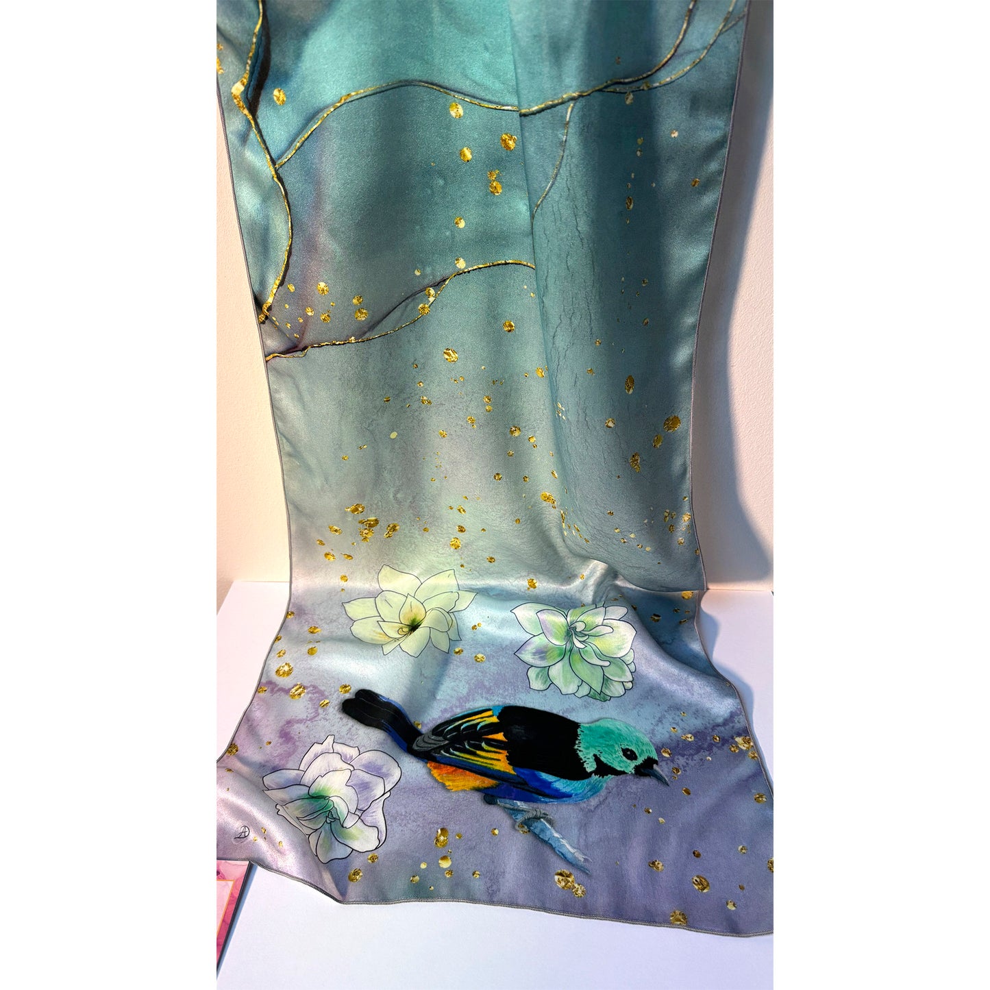Blue silk scarf with floral and exotic tanager bird design on a white background. Unique silk scarf suitable for client appreciation gifts and luxury corporate gifts. 