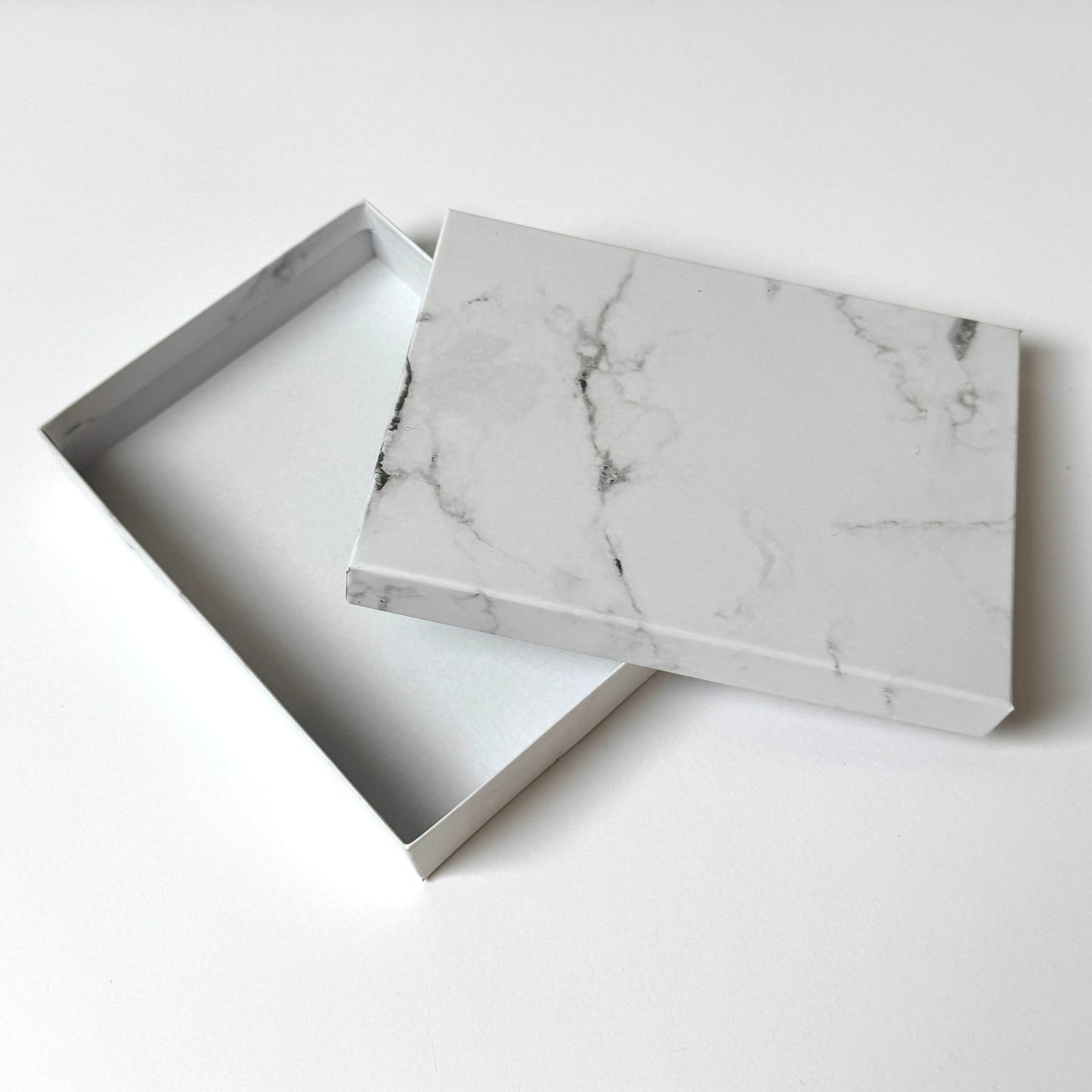 Marble-patterned box on a white background