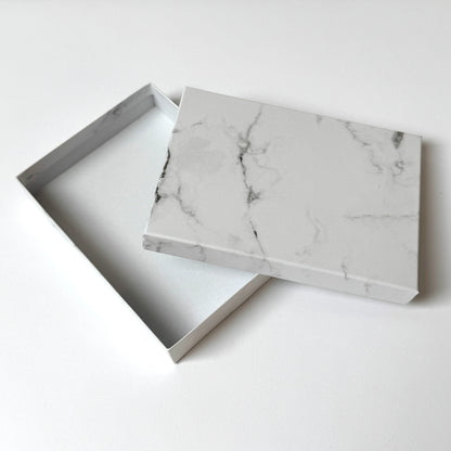 Marble-patterned box on a white background